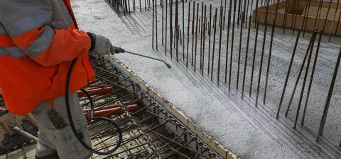 Spraying Sika Antisol white concrete curing compound on a fresh slab in Panchkula